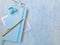 Blue new diary with golden 2021 words, golden pen, blue hairpin, golden jewelry, blue background