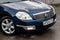 Blue Nissan Teana 2007 year front view with dark black interior in excellent condition on the parking