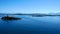 Blue North Sea Near The Coast With Fjords And Mountains Sun Rays Shine On Water