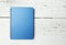 Blue notepad on white wood