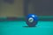 Blue, number 2, billiard ball in a pool table. Vintage style noise effect