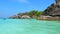 Blue Ocean Beach with Big Rocks, Turquoise Water and Greenery on Tropical Island