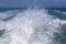Blue ocean sea water wave with fast yacht boat wake foam of prop wash