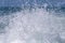 Blue ocean sea water wave with fast yacht boat wake foam of prop wash