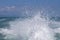 Blue ocean sea water wave with fast yacht boat wake foam of prop wash . Close up