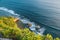 Blue ocean with waves, stones, rocks and cliff in Uluwatu