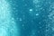 Blue ocean waves from underwater with bubbles. Light rays shining through. Great for backgrounds