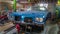 Blue Oldsmobile Delta eighty eight inside a car garage