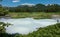 A blue opaque thermal lake in the caldera of an extinct volcano.