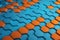 a blue and orange abstract background with hexagonal tiles on the bottom of the image and the bottom of the hexagonal tiles on