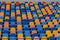 Blue and orange stadium plastic seats. Colorful texture