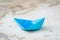 Blue origami paper ship or boat on vintage ocean map with printed compass, travel, sail or cruise concept, shipping.