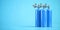 Blue oxygen tanks or cylinders on blue background