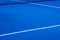 Blue paddle tennis court with artificial grass, racket sports concept