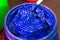 The blue paint in the glass bucket.the blue of plastisol ink