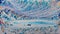 Blue paint patterns on the abstract art background texture resemble the ethereal beauty of a city nestled within an ice cave.