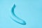 Blue painted banana on the background. creative design. copy space