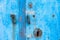 Blue painted door with handles and lock hole