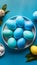 Blue painted eggs arranged on plate, top view Easter composition