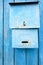 Blue Painted Metal Retro Postbox on Wood