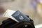 Blue Palestinian Authority passport with airline tickets on touristic backpack close up