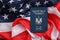 Blue Palestinian Authority passport on United States national flag background close up