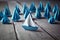 Blue Paper Boat Leading A Fleet Of Small White Boats With Compass Icon On Wooden Table - Leadership Concept Generative AI.