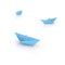 blue paper boats on glossy white surface - perfect serenity - confidently keep afloat metaphor
