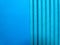 Blue paper tubes on a blue background