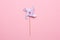 Blue paper windmill pinwheel isolated on pink background, Circus, Childhood, Festival, Party, Fun, joy, Happines