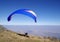 Blue paraglider over city Sofia, Bulgaria