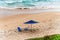 Blue parasol on the sand of Paciencia beach in the Rio Vermelho