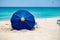 Blue parasol on sandy beach