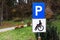 Blue parking sign for disabled persons at city park