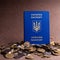 Blue passport of Ukraine on a many of coins.