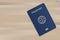 Blue passport on wood background. Vector.