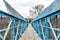 Blue pedestrian bridge over railroad