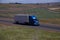 Blue Peterbilt / White unmarked Trailer