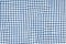 Blue picnic blanket fabric with squared patterns and texture