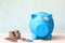 Blue piggy bank attached to the plaster on the head, Save money for Medical insurance and Health care concept