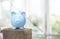 Blue piggy bank on background