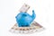 Blue piggy bank with bills hundred rubles