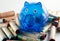 Blue Piggy Bank With Coin Wrappers