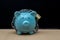 Blue Piggy bank locked, chained with black background, Protect savings, Protect capital, Protect retirement fund concept