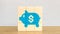 The blue piggy bank  on wood cube for business concept 3d rendering