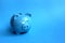 Blue piggy moneybox on blue background a symbol of 2019