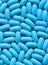 Blue pills seamless macro background.