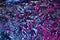 Blue and pink aluminum wrinkled foil background. Abstract bright texture reflecting creative gradient.