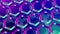 Blue and pink background of hexagons in rotating motion, seamless loop. Motion. Beautiful spinning field of colorful