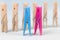 Blue and pink clothespins on the background of ordinary wooden clothespins.